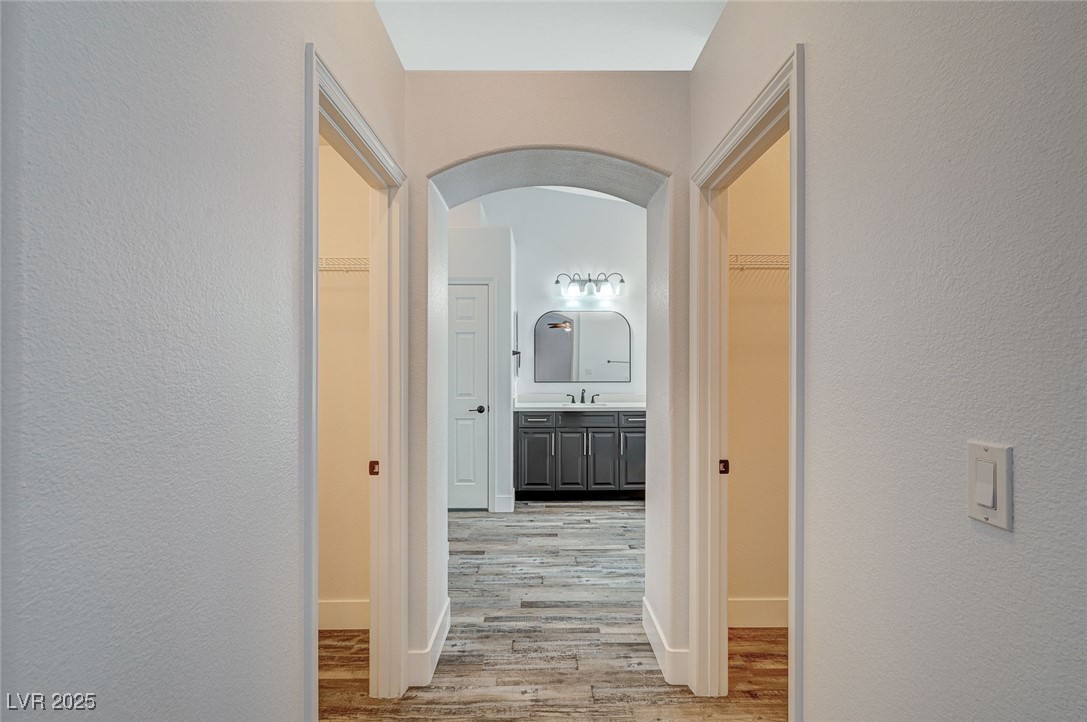1335 Rolling Sunset Street Henderson, NV 89052 - Photo 10 of 72 Hall featuring a sink, light wood-type flooring, a