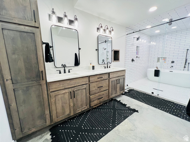 100 Whit Lane Georgetown, ID 83239 - Photo 31 of 76 Full bathroom with double vanity, a freestanding tub, concrete flooring, and tiled shower