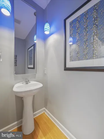 a bathroom with a sink and mirror