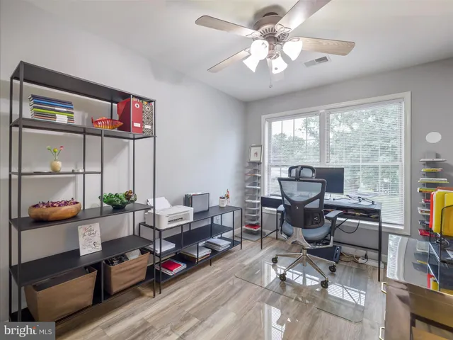 a view of room with window and cabinet
