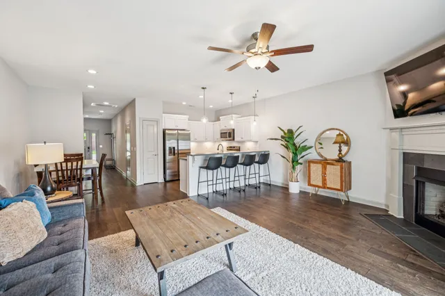 a living room with fireplace furniture and a flat screen tv