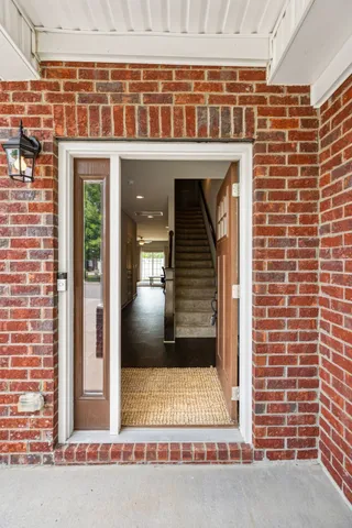 a view of a brick building with a bench