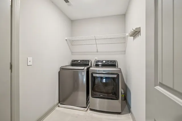 a utility room with washer and dryer