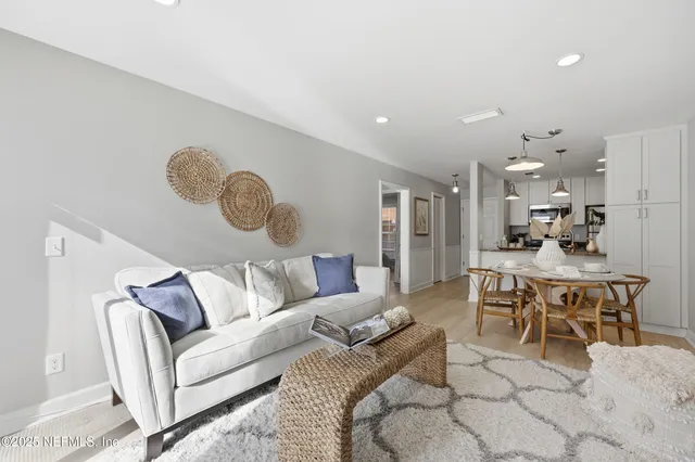 a bed room with a bed and a chandelier