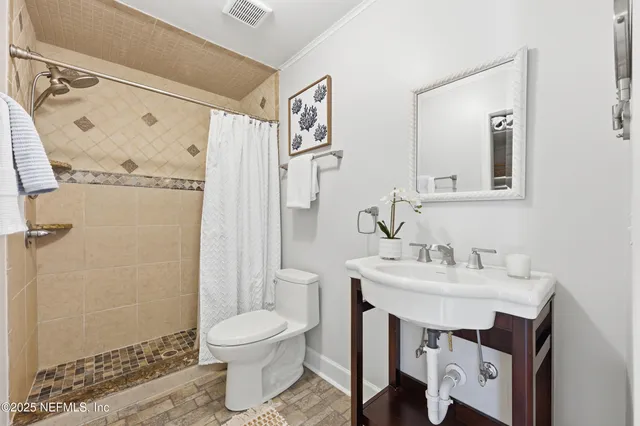 a view of bedroom with a bed and closet