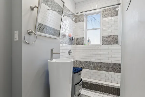 a bathroom with a sink and a shower