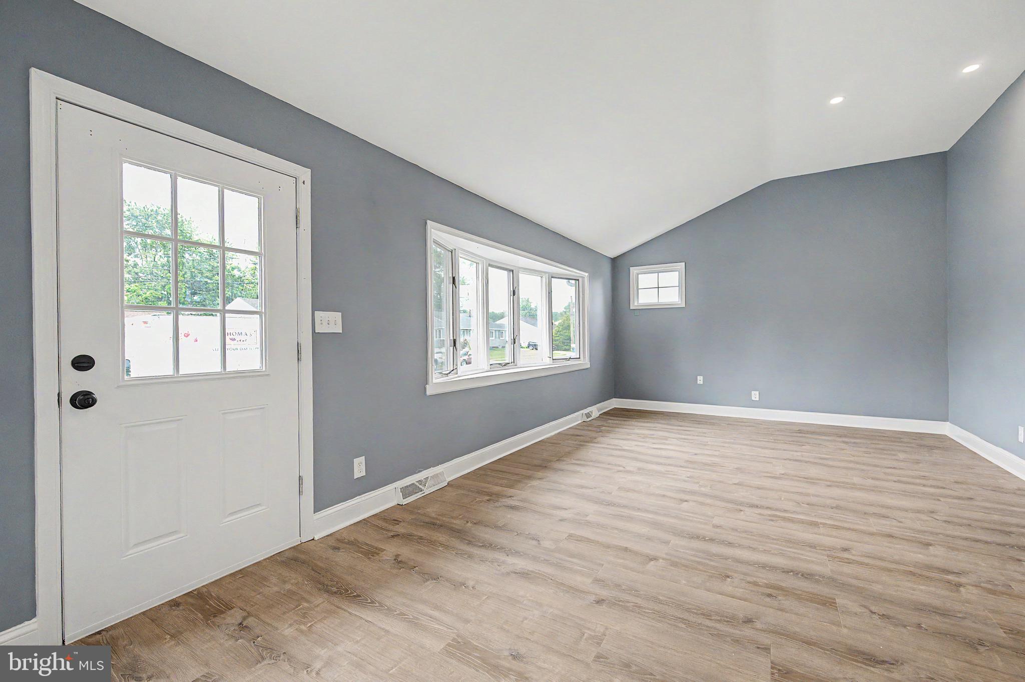 16 Malvern Road Newark, DE 19713 - Photo 5 of 35 a view of an empty room with wooden floor and a window