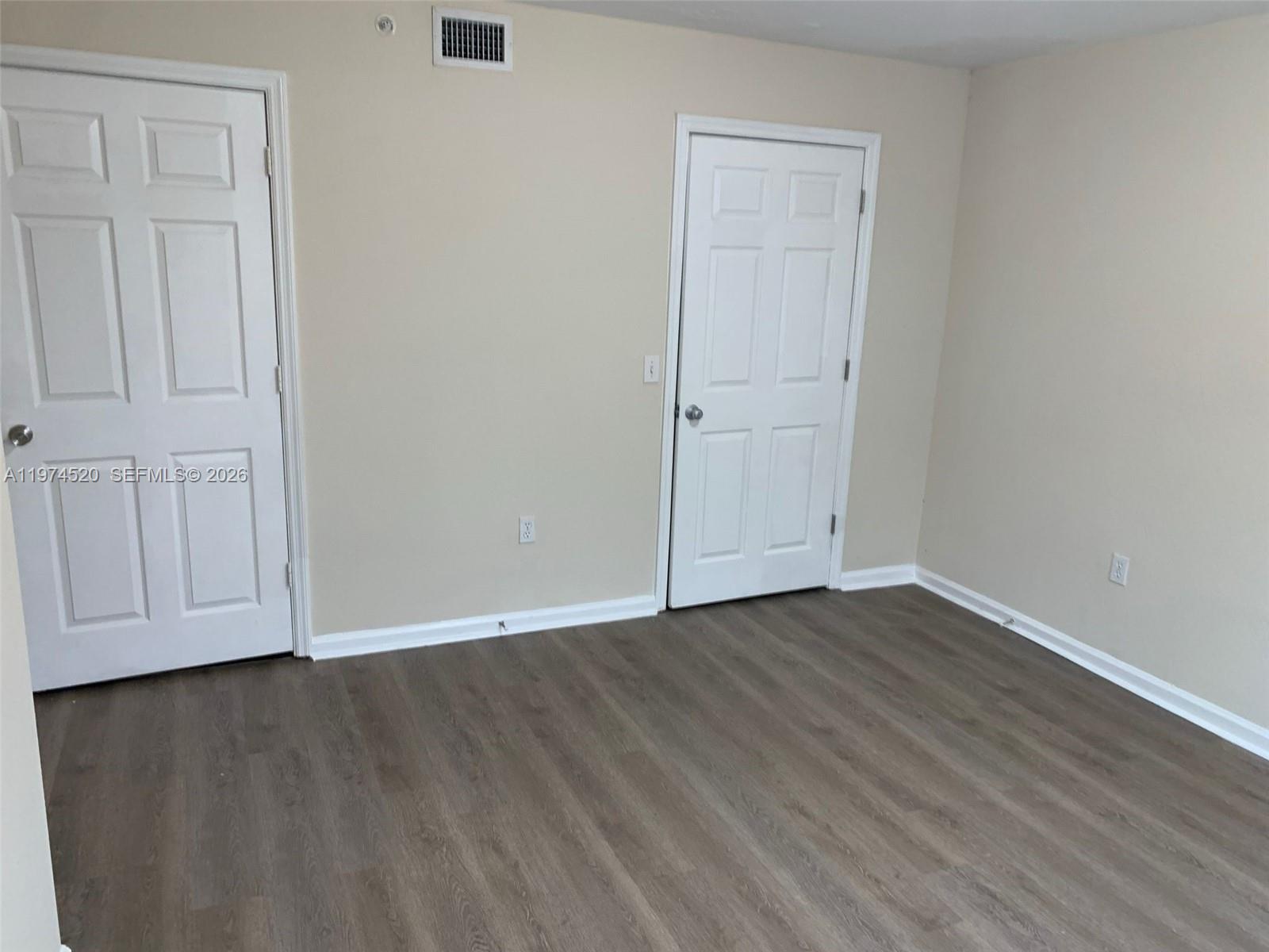 15440 Southwest 284th Street, Unit 5102 Homestead, FL 33033 - Photo 11 of 27 a view of an empty room with wooden floor