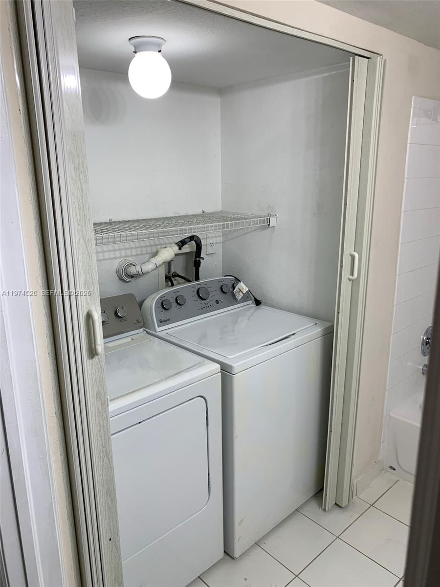 15440 Southwest 284th Street, Unit 5102 Homestead, FL 33033 - Photo 16 of 27 a utility room with dryer and washer