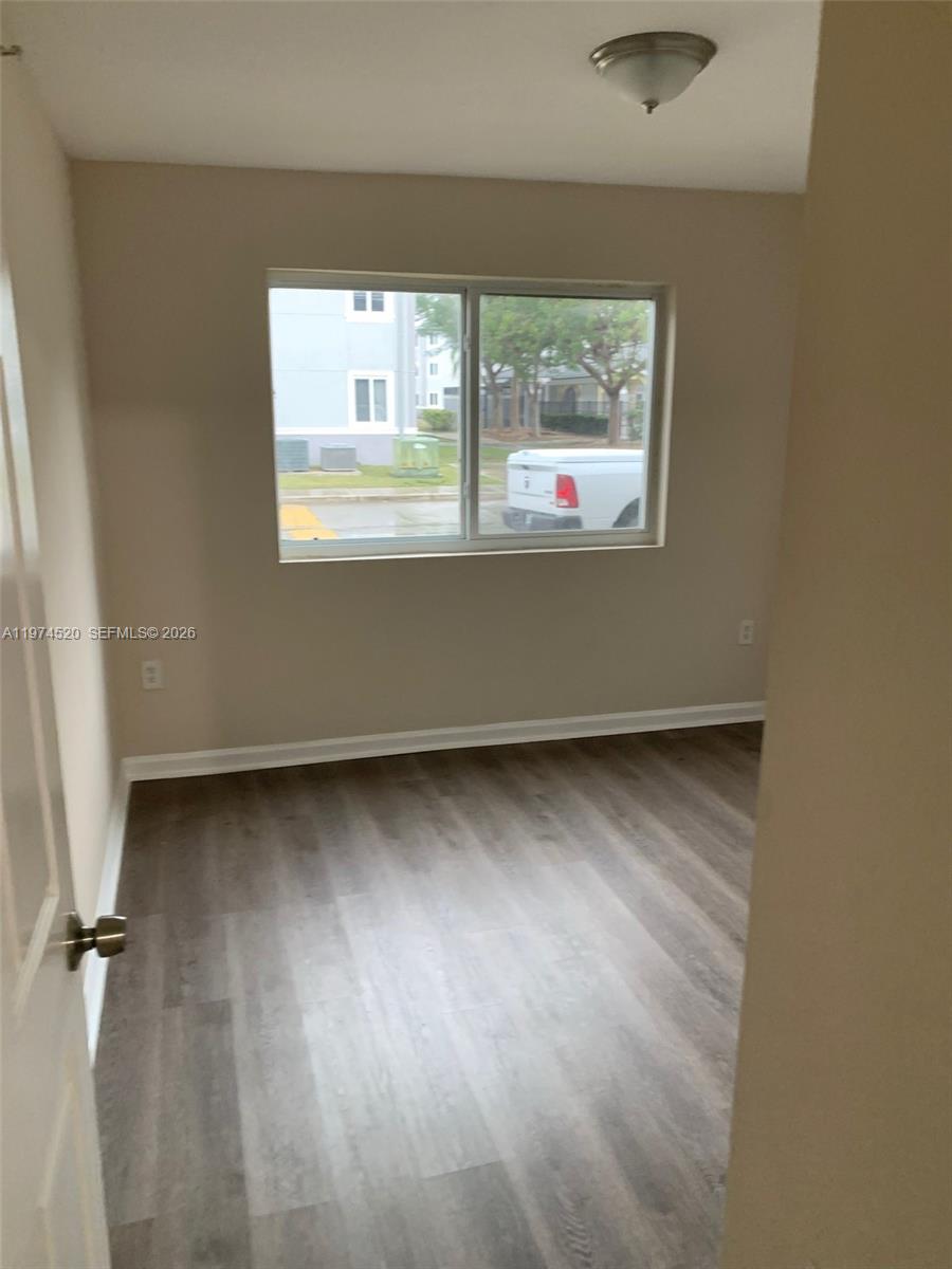 15440 Southwest 284th Street, Unit 5102 Homestead, FL 33033 - Photo 21 of 27 an empty room with windows