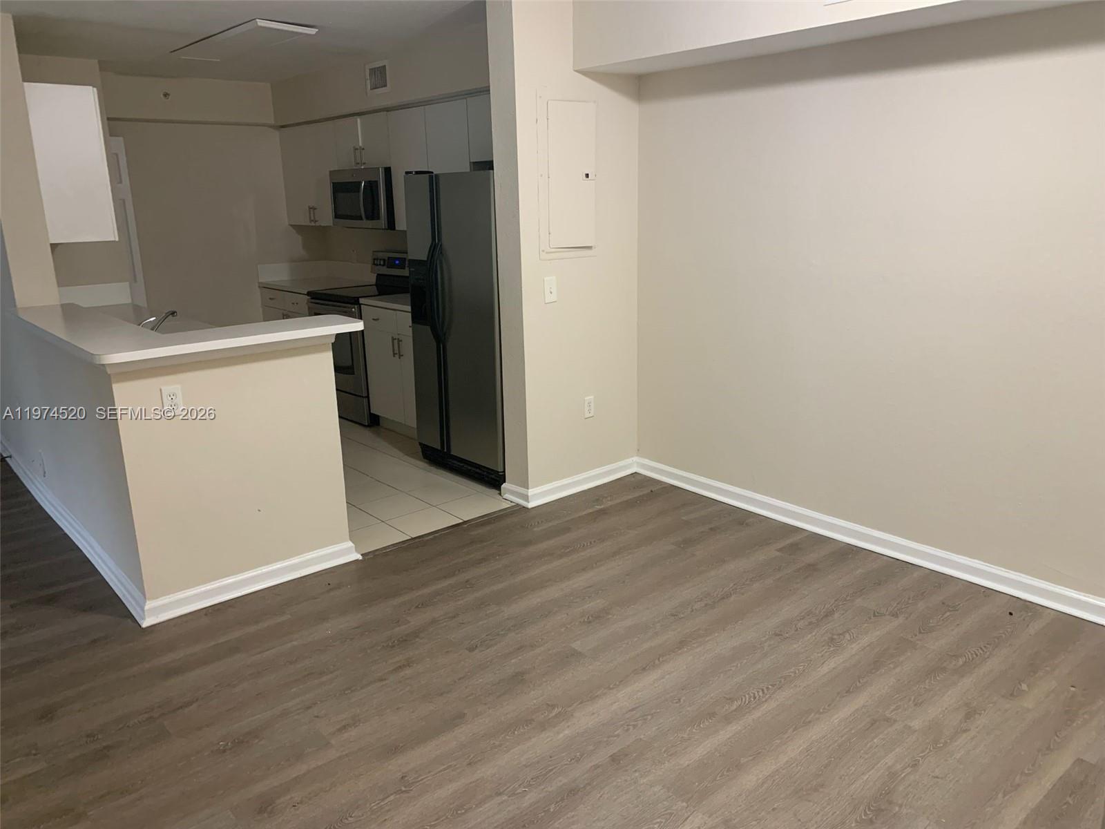 15440 Southwest 284th Street, Unit 5102 Homestead, FL 33033 - Photo 27 of 27 a view of a kitchen with wooden floor and a sink