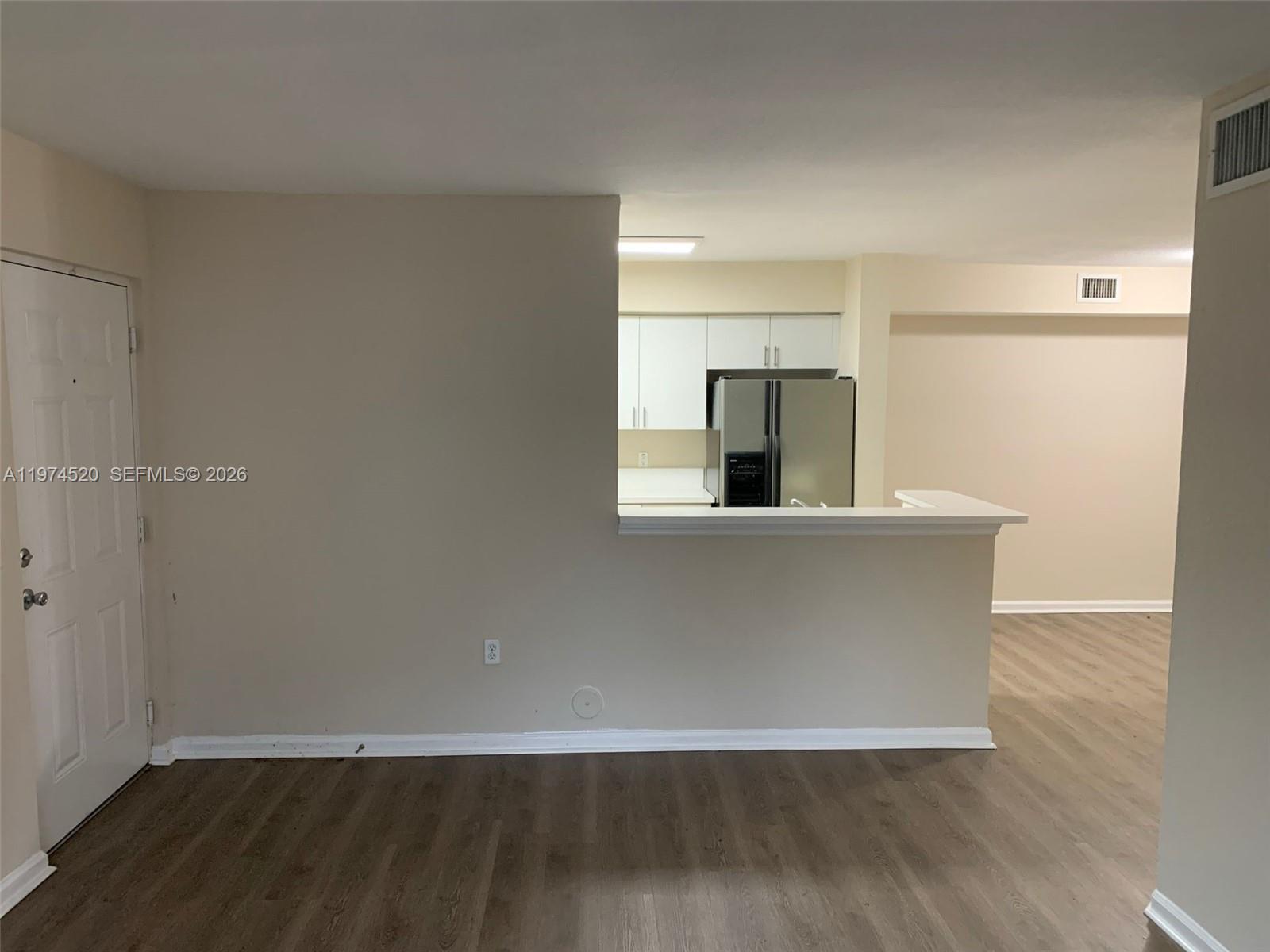 15440 Southwest 284th Street, Unit 5102 Homestead, FL 33033 - Photo 4 of 27 a view of a kitchen with wooden floor