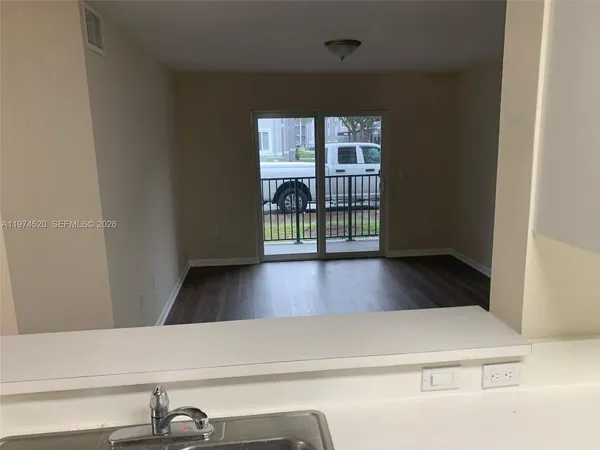 a view of balcony with a floor to ceiling window