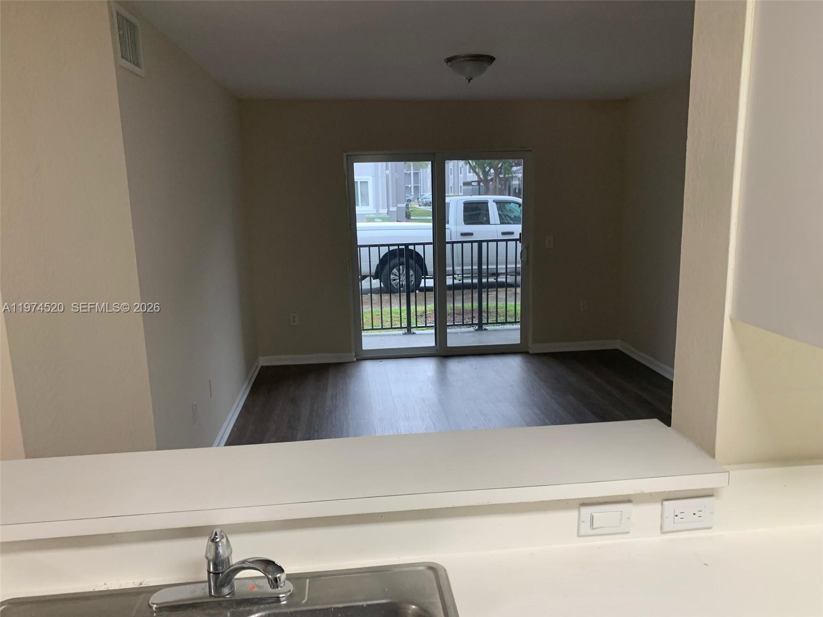 15440 Southwest 284th Street, Unit 5102 Homestead, FL 33033 - Photo 9 of 27 a view of balcony with a floor to ceiling window