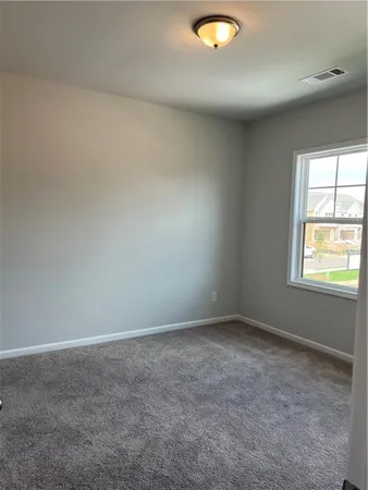 a bathroom with a double vanity sink toilet and shower