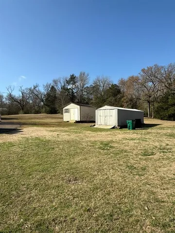 a large body of water with a building in the background