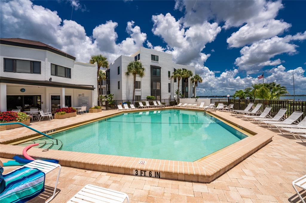 2955 North Beach Road, Unit B614 Englewood, FL 34223 - Photo 40 of 67 a view of a house with swimming pool and sitting area