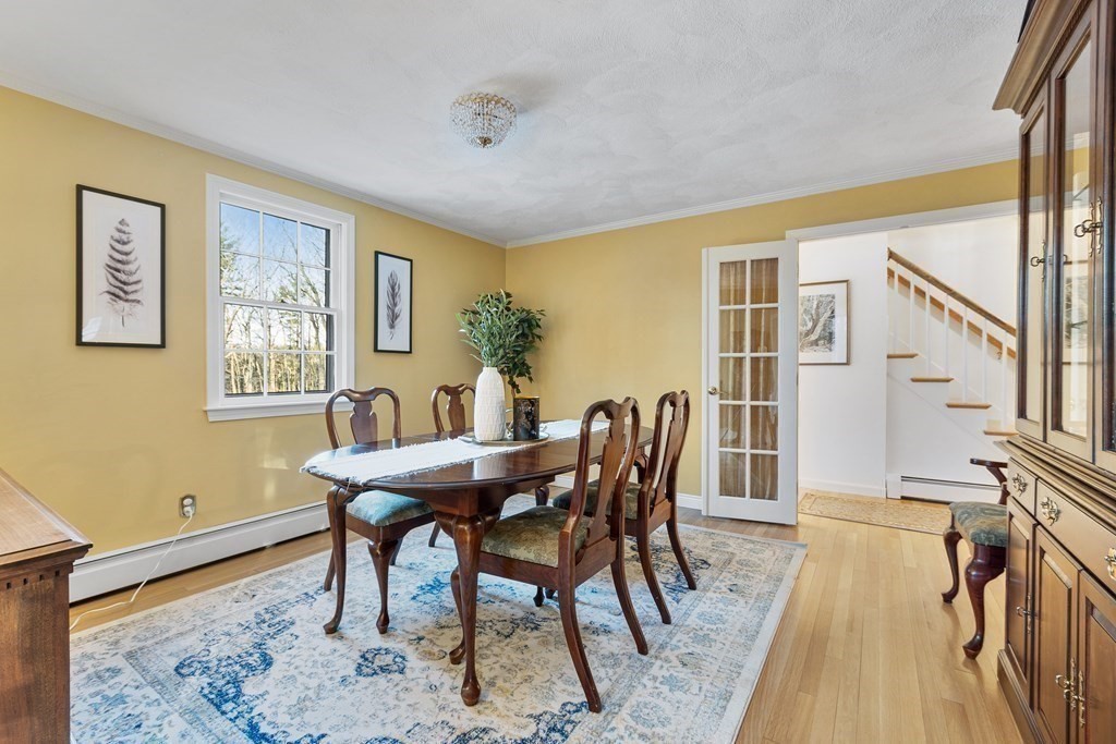 420 Old Harvard Road Boxborough, MA 01719 - Photo 13 of 37 a view of a dining room with furniture and wooden floor