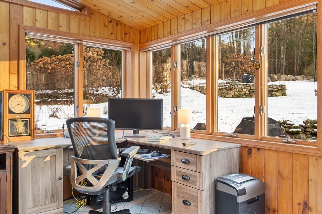 420 Old Harvard Road Boxborough, MA 01719 - Photo 19 of 37 a view of a workspace with furniture and a window