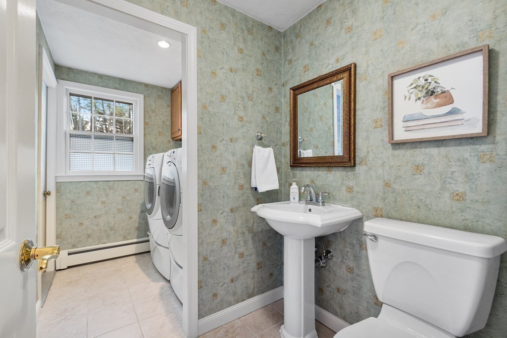 420 Old Harvard Road Boxborough, MA 01719 - Photo 21 of 37 a bathroom with a sink mirror and toilet