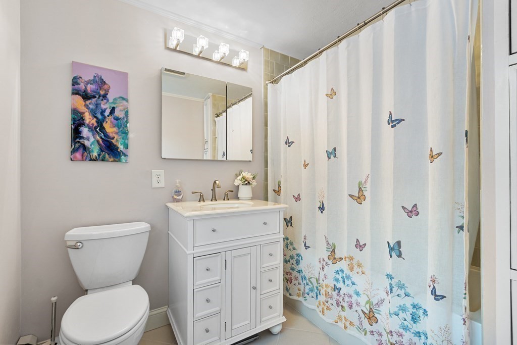 420 Old Harvard Road Boxborough, MA 01719 - Photo 26 of 37 a bathroom with a toilet sink and mirror