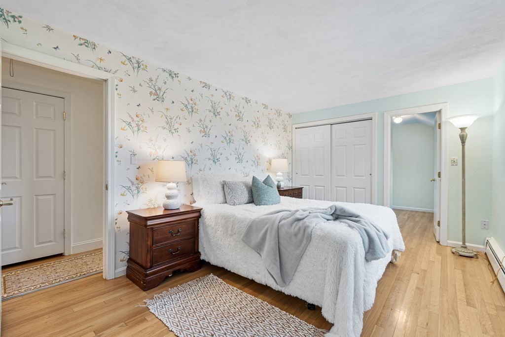 420 Old Harvard Road Boxborough, MA 01719 - Photo 27 of 37 a bed room with a bed and a chair