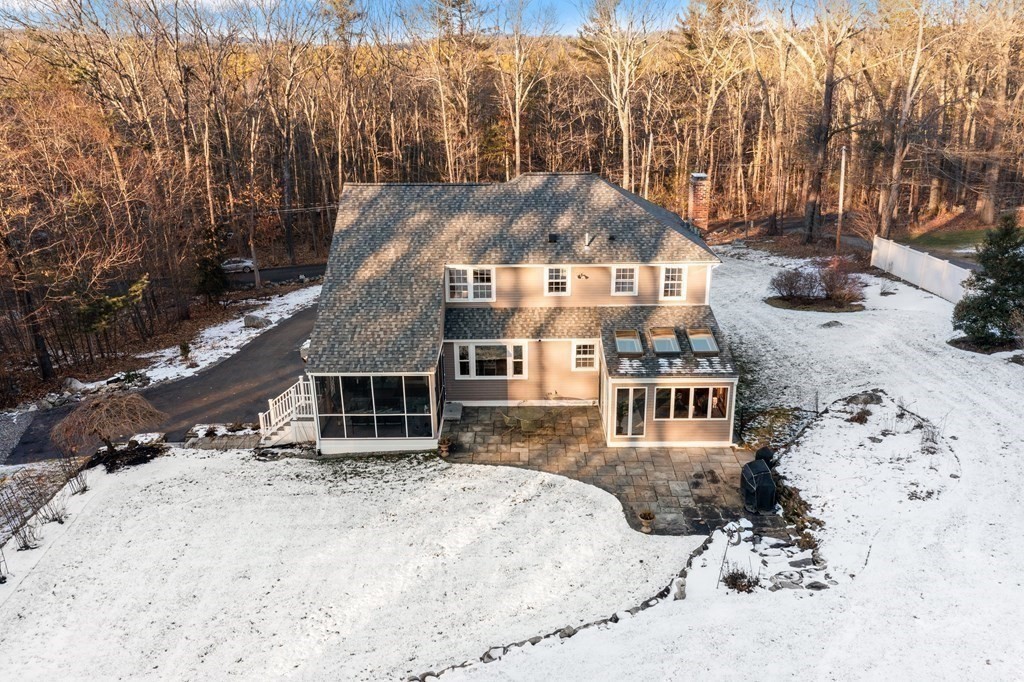 420 Old Harvard Road Boxborough, MA 01719 - Photo 33 of 37 a front view of a house with a yard covered in snow