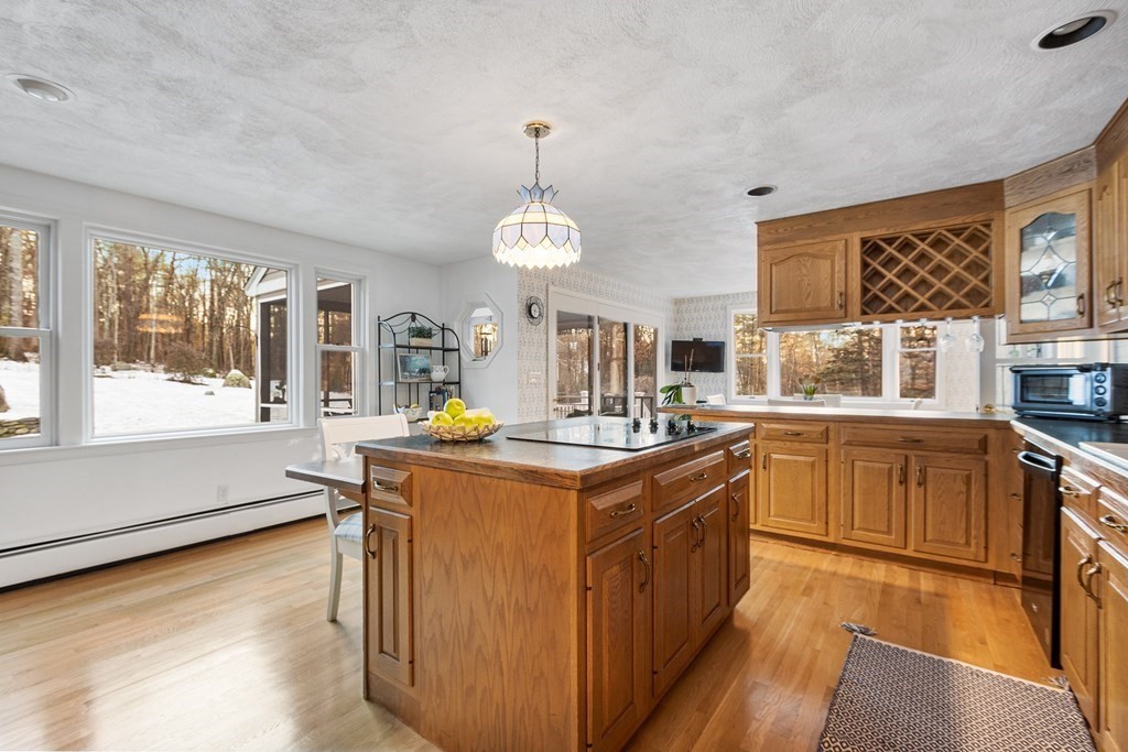 420 Old Harvard Road Boxborough, MA 01719 - Photo 6 of 37 a kitchen with stainless steel appliances granite countertop a stove and a large window