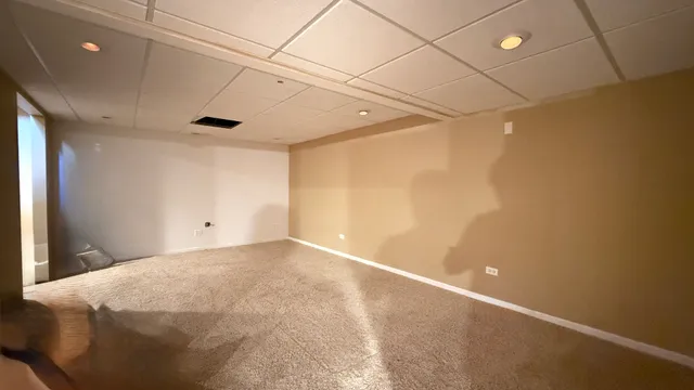 a view of a room with a air conditioner and kitchen countertops