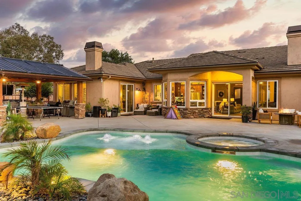 a view of a swimming pool with a patio