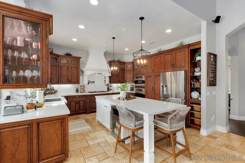 11130 Boulder Pass Escondido, CA 92026 - Photo 12 of 55 a large kitchen with a table and chairs