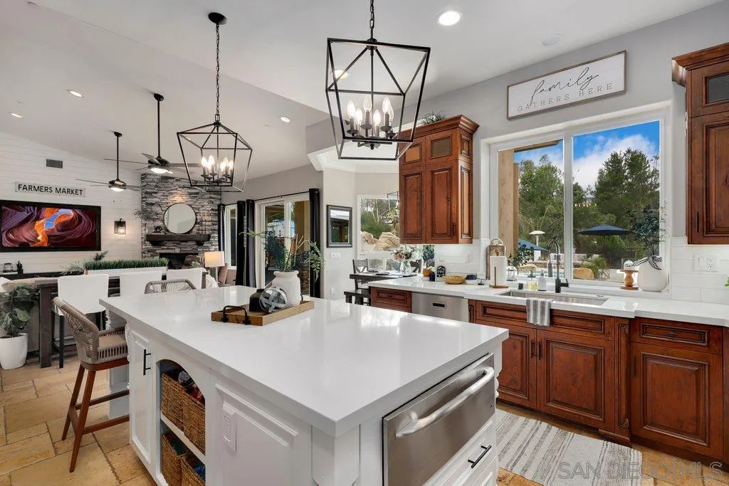 11130 Boulder Pass Escondido, CA 92026 - Photo 13 of 55 a kitchen that has a lot of cabinets in it
