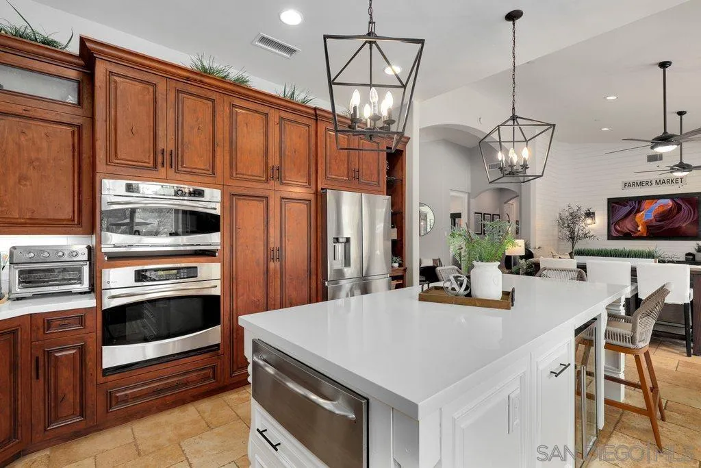 11130 Boulder Pass Escondido, CA 92026 - Photo 14 of 55 a kitchen with stainless steel appliances a stove a sink island and refrigerator