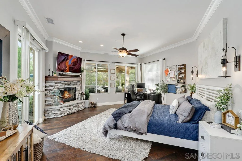 11130 Boulder Pass Escondido, CA 92026 - Photo 15 of 55 a living room with furniture fireplace and flat screen tv