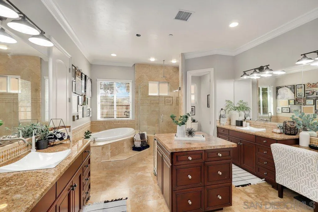 11130 Boulder Pass Escondido, CA 92026 - Photo 17 of 55 a bathroom with a granite countertop sink and a large mirror