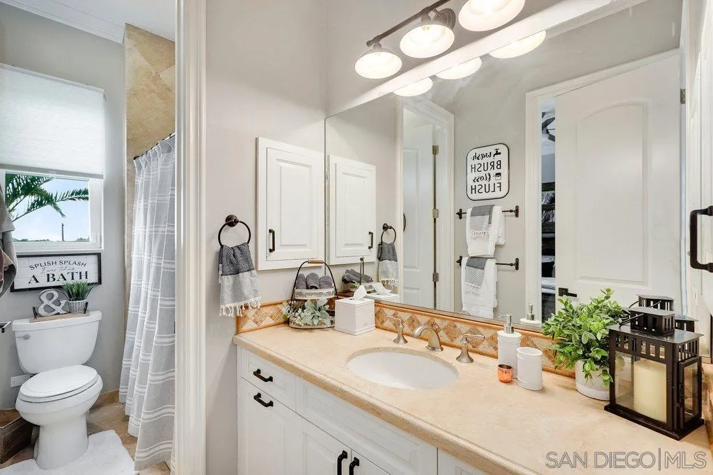 11130 Boulder Pass Escondido, CA 92026 - Photo 23 of 55 a bathroom with a sink vanity granite and a toilet