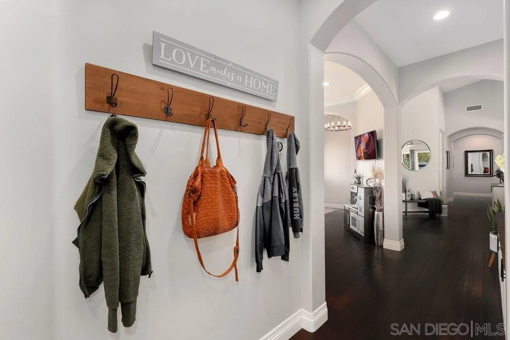 11130 Boulder Pass Escondido, CA 92026 - Photo 26 of 55 a view of walk in closet with clothes and shoes