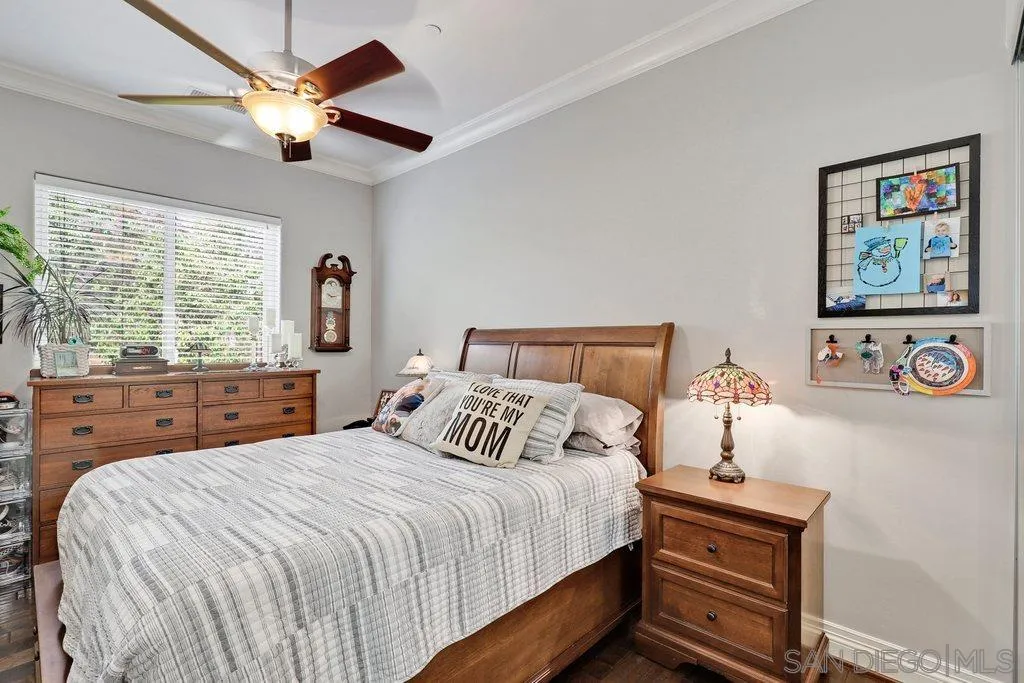 11130 Boulder Pass Escondido, CA 92026 - Photo 33 of 55 a bedroom with a large bed and a large window