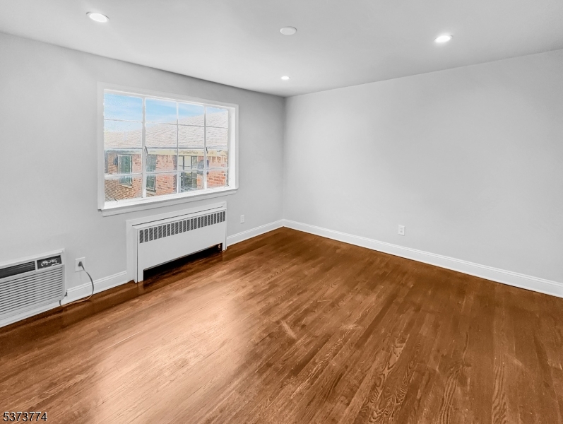 5 Troy Drive Springfield, NJ 07081 - Photo 11 of 21 an empty room with wooden floor and windows
