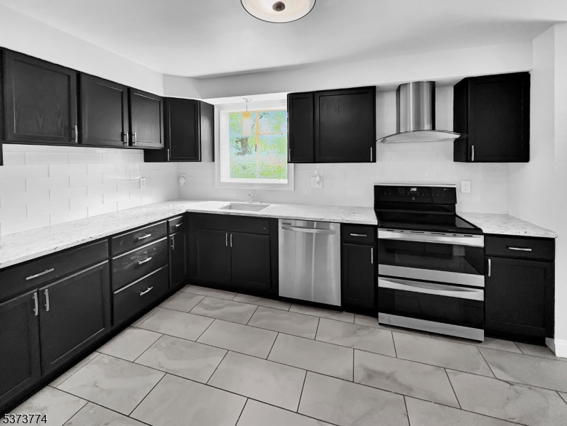 5 Troy Drive Springfield, NJ 07081 - Photo 6 of 21 a kitchen with a sink and a stove top oven