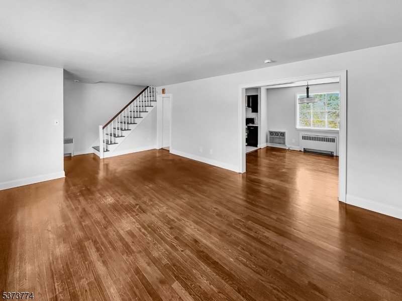 5 Troy Drive Springfield, NJ 07081 - Photo 9 of 21 a view of empty room with wooden floor