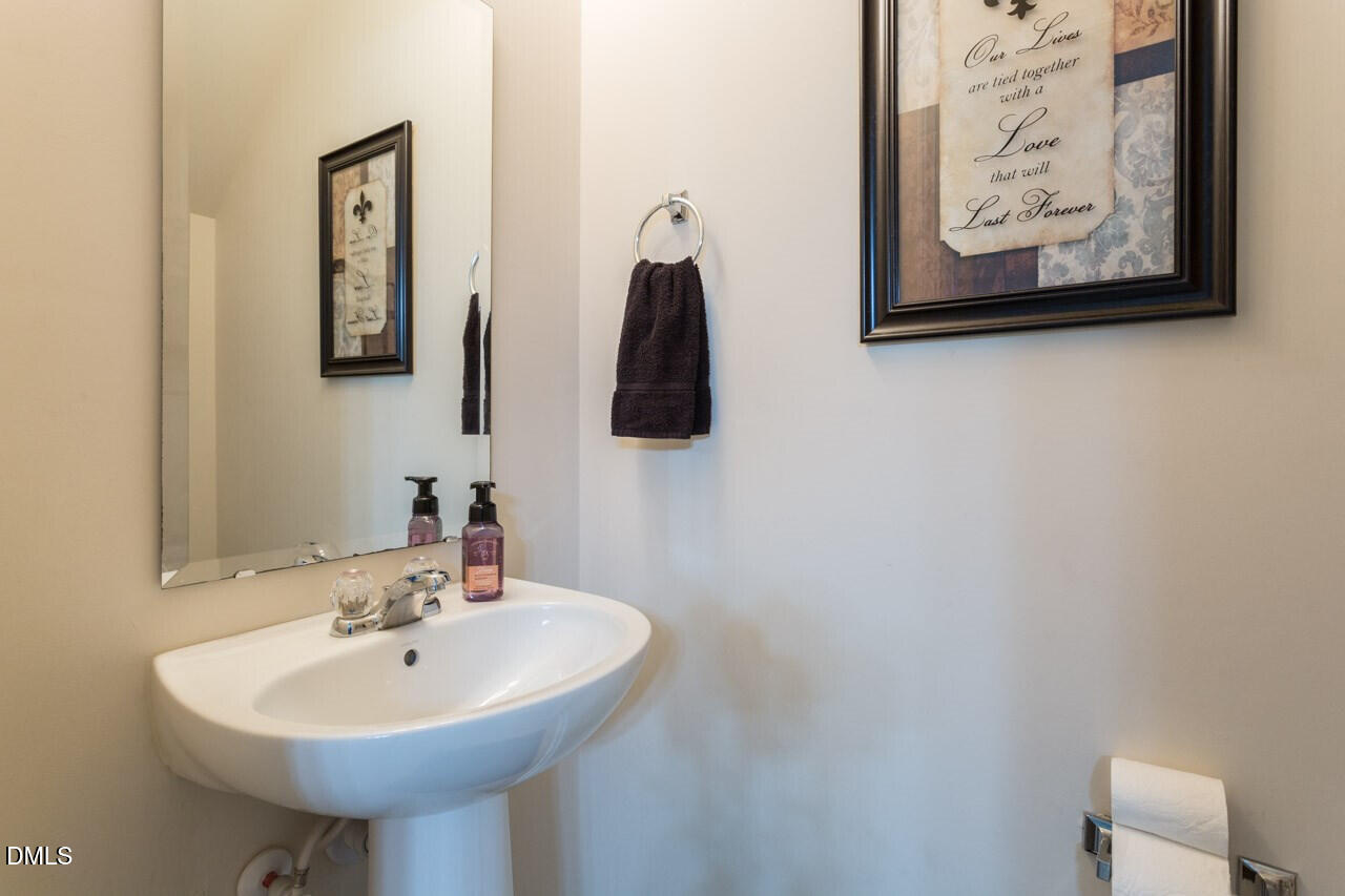 4009 Tresco Crossing Raleigh, NC 27616 - Photo 21 of 23 a bathroom with a sink and a mirror