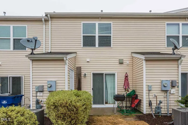 a side view of a house with patio