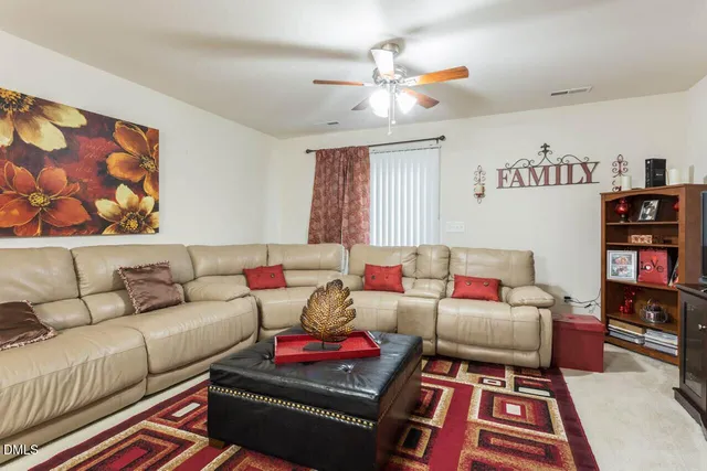 a living room with furniture and a couch