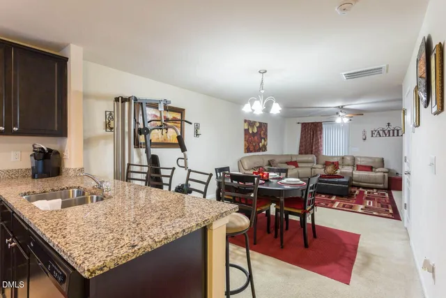 a view of a kitchen and dining area