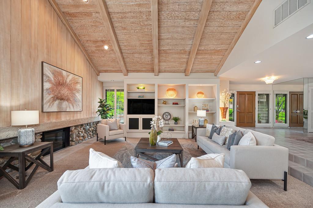 7650 Pineridge Road Fair Oaks, CA 95628 - Photo 13 of 67 Large, open living room with a fireplace, open-beam ceiling, and built-in cabinets