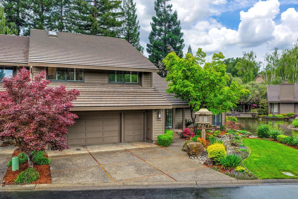 7650 Pineridge Road Fair Oaks, CA 95628 - Photo 54 of 67 View of the home, front yard, and the lake