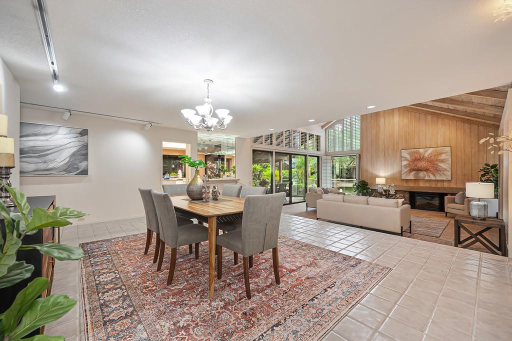 7650 Pineridge Road Fair Oaks, CA 95628 - Photo 8 of 67 Dining area looking toward the large, open living room, and views of the lake