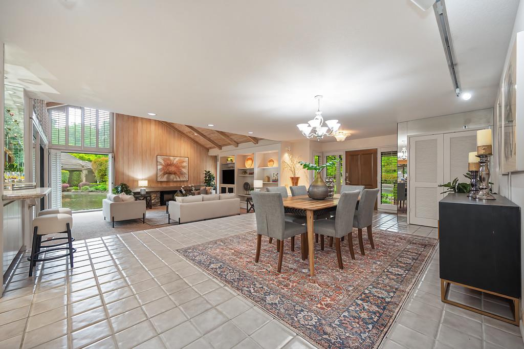7650 Pineridge Road Fair Oaks, CA 95628 - Photo 9 of 67 Dining area looking toward the large, open living room, and views of the lake