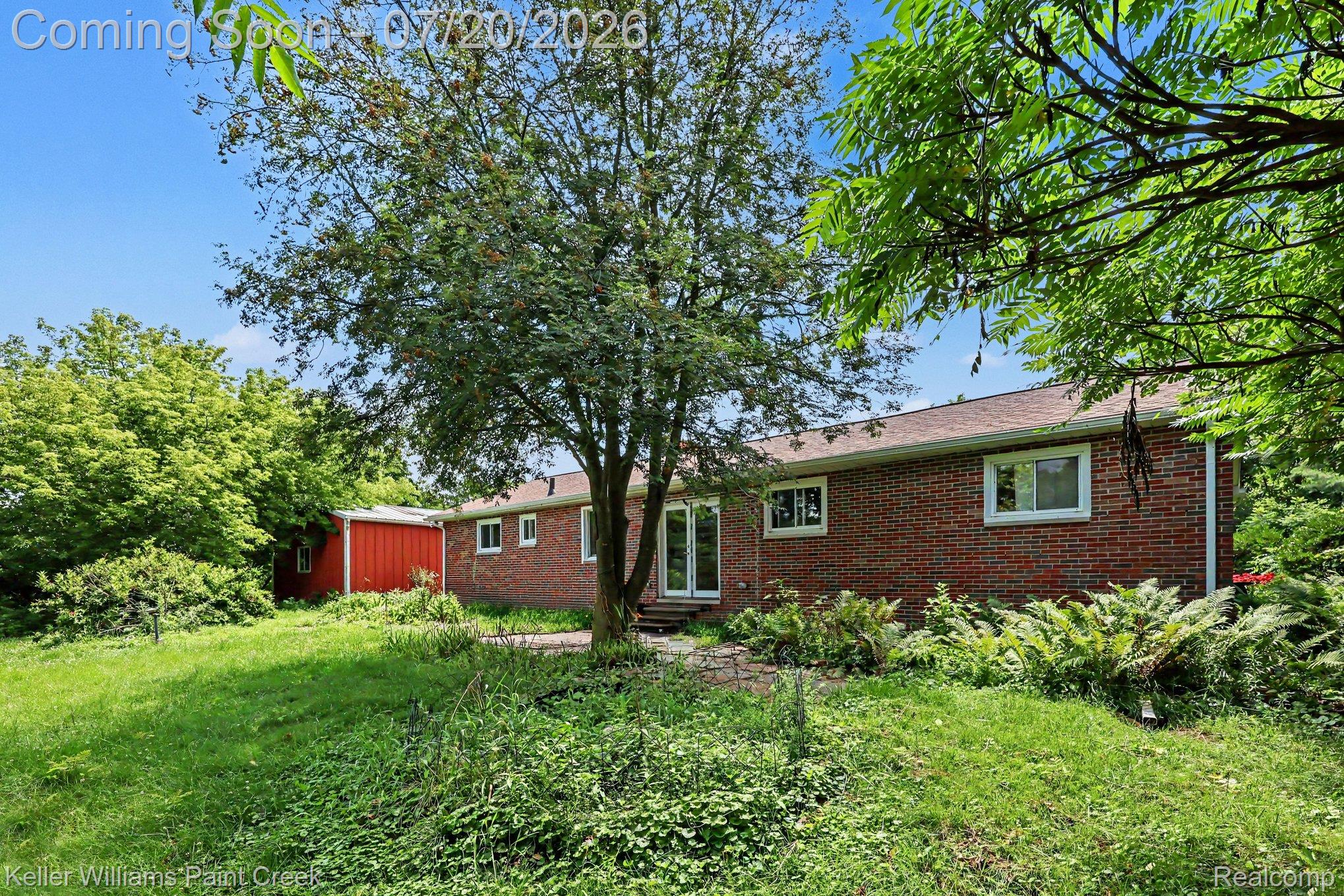 1371 East Leonard Road Leonard, MI 48367 - Photo 27 of 32 Expansive green lawn with mature trees and established landscaping